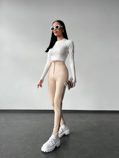 Women's leggings made of eco leather on fleece with a high fit, color beige.