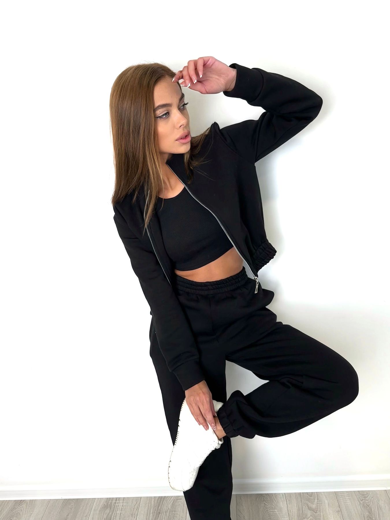 Warm women's tracksuit with joggers and a cropped jacket with a