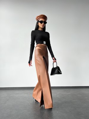 Wide trousers made of eco-leather.