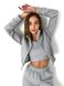 Warm women's tracksuit with joggers and a cropped jacket with a zipper in gray.