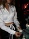 Cropped satin shirt with lacing in ivory color