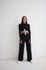 Fashion women's lightweight ribbed knitted suit with wide leg pants and long sleeve top .