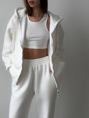 Warm women's sports suit with joggers and an elongated jacket with a zipper.