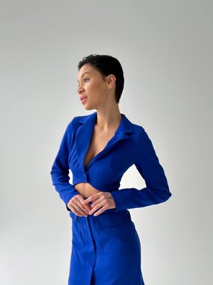 Dress-jacket in electric blue color with an ingenious neckline and patch pockets.