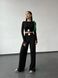Fashion women's lightweight ribbed knitted suit with wide leg pants and long sleeve top.