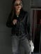 Women's leather jacket made of high-quality eco-leather suede with a metal zipper and black buttons...................