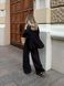 Women's suit &mdash; black shirt and trousers