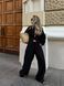 Women's suit &mdash; black shirt and trousers
