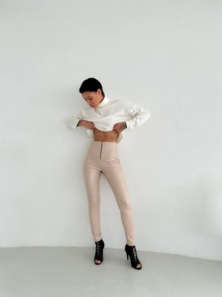 Women's leggings made of eco leather on fleece with a high fit, color beige.