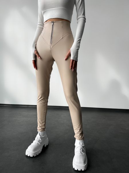 Women's leggings made of eco leather on fleece with a high fit, color beige.